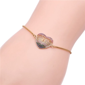 Adjustable golden snake chain bracelet featuring a colorful heart pendant with zircon stones