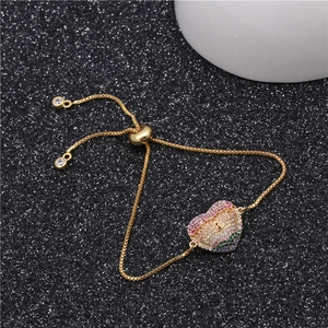 Adjustable gold plated heart bracelet with colorful cubic zirconia and sliding clasp closure