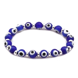 Handmade evil eye beaded bracelet with blue resin eye beads and silver spacers