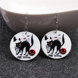 Halloween drop earrings featuring black cat and pumpkin motifs on white circular discs