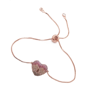 Detail of rose gold heart bracelet with pavé colored zircons and adjustable slider clasp