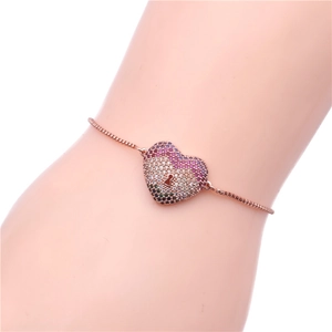 Close-up of adjustable rose gold box chain bracelet with colorful zircon heart charm