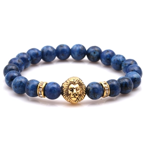 Blue volcanic stone beaded bracelet with golden lion head charm and sparkly spacers