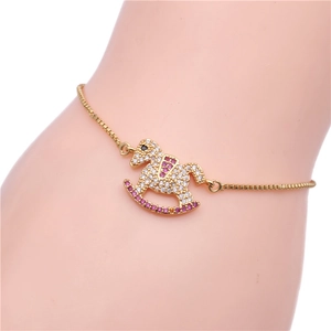 Pulsera de caballo balancín dorada con cristales de circonita de colores para mujer