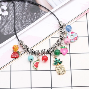 Colorful fruit pendant necklace featuring strawberry, watermelon, and pineapple charms