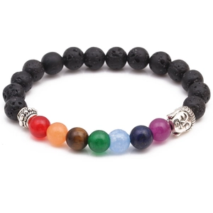 Detailed macro view of 8mm lava rock beads and chakra gemstones with silver buddha charm
