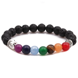 Detail of 8mm lava rock chakra bracelet with colorful beads and a silver buddha head