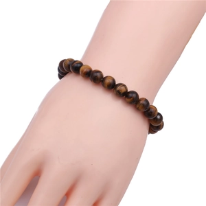 Close-up of 8mm blue tiger eye stone beaded bracelet with natural silky luster on wrist