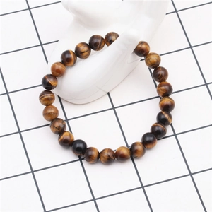Close-up of 8mm natural tiger eye stone beads on a display stand with silky luster