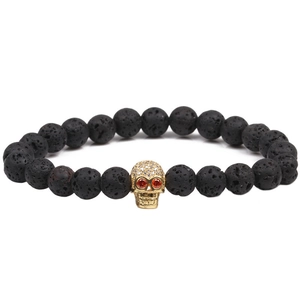 Lava stone skull bead bracelet with gold-plated zircon head and red eye stones