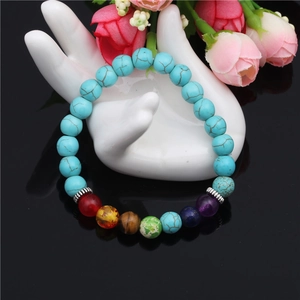 Chakra beaded bracelet with 8mm colorful agate and turquoise stones on a hand model