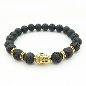 Zen-style black lava stone beaded bracelet with gold Buddha head and spacer beads