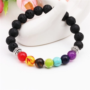 Chakra lava stone bracelet with 8mm colorful beads on a hand display stand