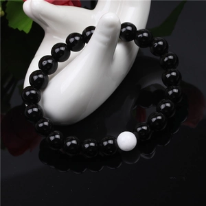 Classic 8mm black onyx bead bracelet for men with single matte white accent stone