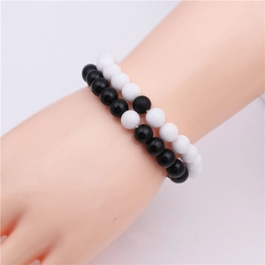 Minimalist 8mm beaded bracelet set with glossy black onyx and matte white stones