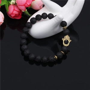 8mm black lava stone beaded bracelet for men featuring a vintage gold Hamsa Hand charm