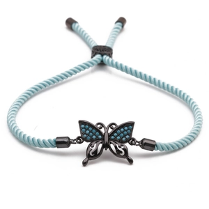 Adjustable sky blue braided rope bracelet featuring a black butterfly zircon charm