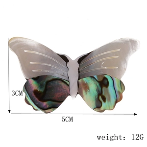 Detailed view showing vintage butterfly brooch size 5cm by 3cm with abalone shell inlay