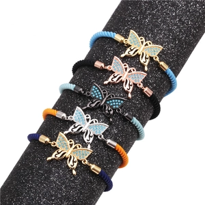 Detailed close-up of colorful butterfly charm bracelets with turquoise cubic zirconia stones