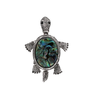 Vintage silver turtle brooch featuring colorful iridescent abalone shell inlay