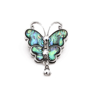 Fashionable butterfly brooch with abalone shell wings and sparkling crystal pendants