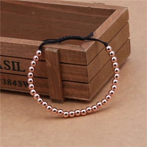 Minimalist woven bracelet with 4mm rose gold copper beads and adjustable black cord strap