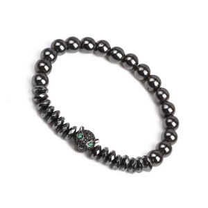 Detail of beaded hematite bracelet featuring a black leopard head with green zircon eyes
