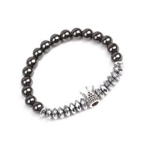 Detail of beaded crown bracelet with black hematite stones and zircon pavé crown charm