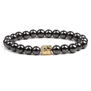 Magnetic hematite beaded bracelet featuring a golden Buddha head bead on white background