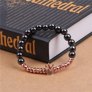 Detail of beaded crown bracelet with black stones and rose gold zircon accents