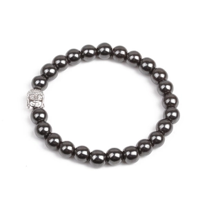 Detailed macro view of dark grey hematite beads with a silver buddha head charm