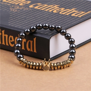 Detail view of hematite beads bracelet with golden crown and black micro zircon stones