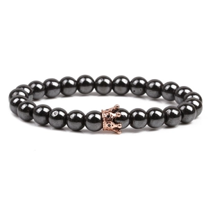 Magnetic hematite bead bracelet for men featuring a rose gold crown with black cubic zirconia