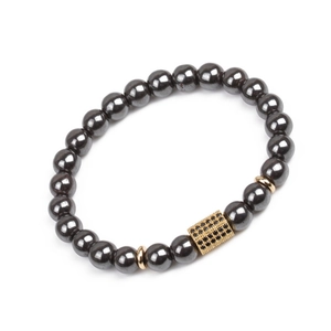 Detail of magnetic hematite beads bracelet with a gold micro-pave black zircon cylinder