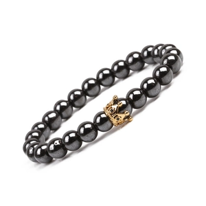 Men's magnetic hematite bead bracelet featuring a gold crown charm with zircon inlay