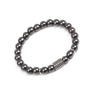Close-up of black hematite beaded bracelet featuring a silver zircon bar accent piece