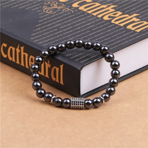 Close-up of magnetic hematite beaded bracelet with micro-pave black zircon square charm