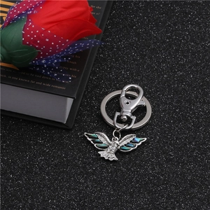 Detailed eagle keychain with colorful abalone shell wings and white sparkling rhinestones