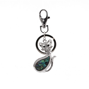 Detailed view of cat keychain with iridescent abalone shell inlay and crystal rhinestones