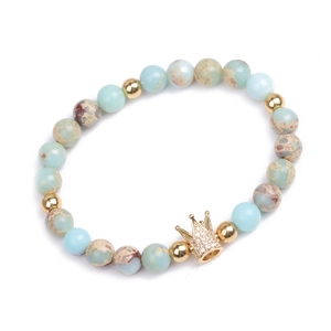 Blue emperor stone beaded bracelet featuring a gold crown charm with zircon inlay