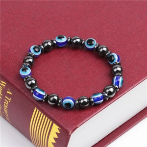 Elastic beaded bracelet with blue evil eye resin beads and black magnetic hematite stones