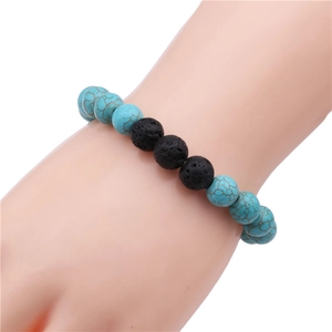 Men's 10mm turquoise and black lava rock beaded bracelet shown on wrist for daily style