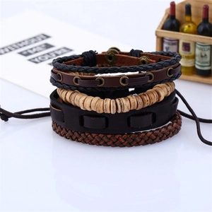 Set of four vintage braided leather and wooden bead bracelets for men in layered style