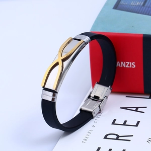 Minimalist black silicone and stainless steel bracelet with golden X detail for men