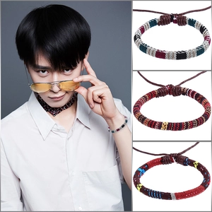 Detailed view of handmade colorful braided cotton friendship bracelets with adjustable cords