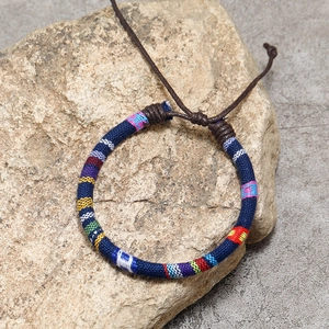 Handmade bohemian colorful woven friendship bracelet with adjustable braided cotton cord