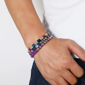 Three-piece set of handmade braided ethnic bracelets with colorful geometric cotton rope