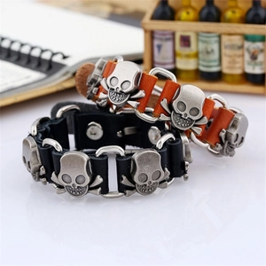 Punk style genuine leather bracelet with vintage alloy skulls and metal snap buttons