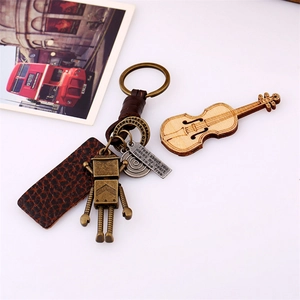 Handwoven leather keychain with vintage robot pendant and engraved metal tag for couples