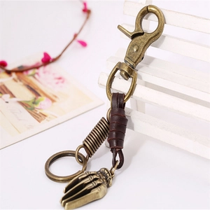 Vintage bronze skeleton hand keychain with brown leather strap and sturdy lobster clasp